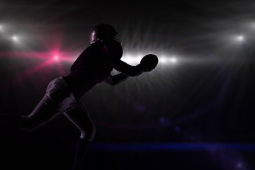 Fototapeta na wymiar Composite image of silhouette american football player 