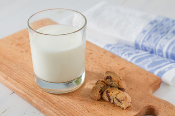 Milk and cookies on white background