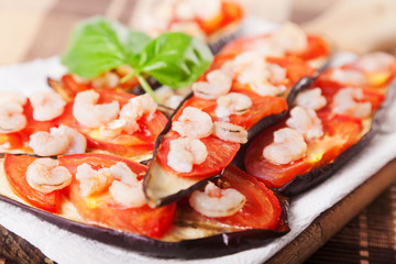 Eggplants with tomato and shrimps