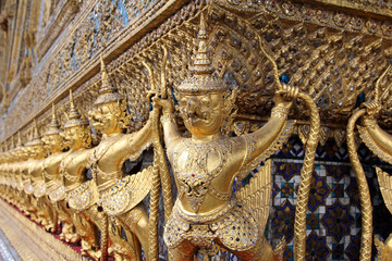 The statues of Krut battling naga serpent, a Thai Buddhist adaptation of Garuda in Wat Phra Kaeo...