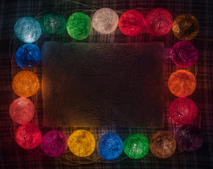 Colorful garland with space for text on the black background