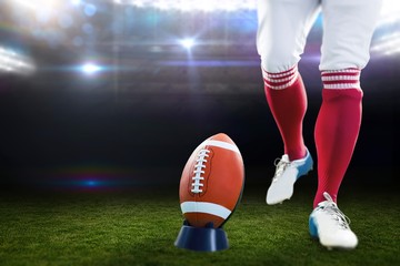 Composite image of american football player being about to kick 
