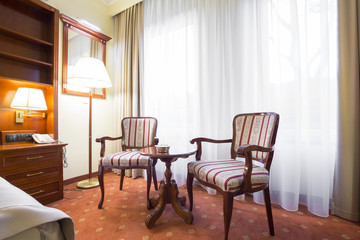 Naklejka na ściany i meble Elegant hotel room interior