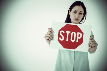 Composite image of sad woman showing sign