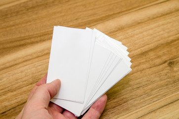 business card presentation for promotion on wooden table