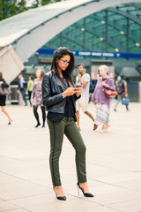 Obraz premium Young mixed race businesswoman portrait outdoors in Canary Wharf. London.
