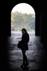 Silouette portrait of young woman outdoors. Parma, Italy.