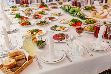 Table served in restaurant with tasty meals.