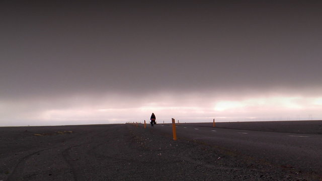 cyclist in deserted landscape in iceland