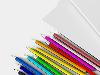 notebook with colored pencils on White background