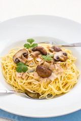 Spaghetti carbonara with brown mushroom
