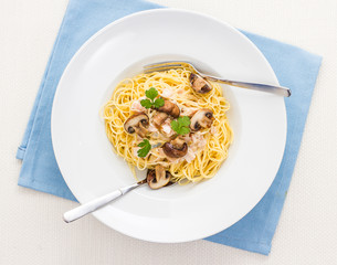 Spaghetti carbonara with brown mushroom