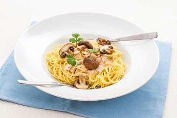 Spaghetti carbonara with brown mushroom