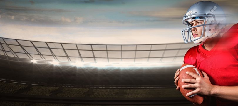 Determined american football player looking away