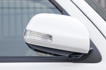 Side rear-view mirror closed for safety at car park