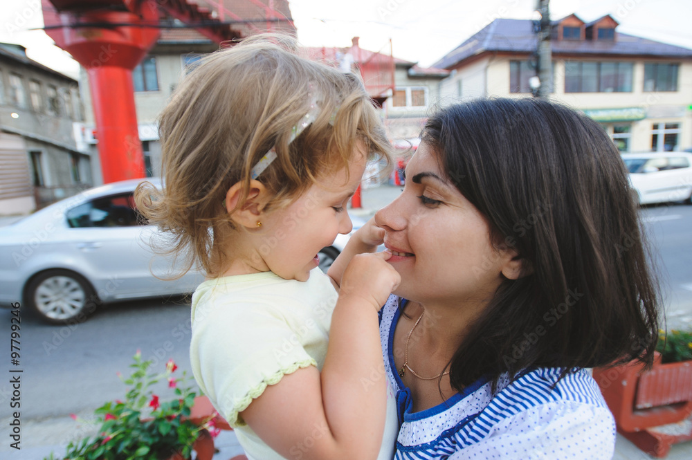 Wall mural Girl Touching Mother's Lips