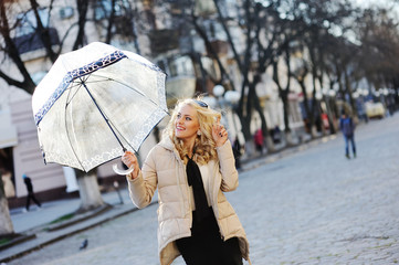 beautiful young blond woman with an umbrella