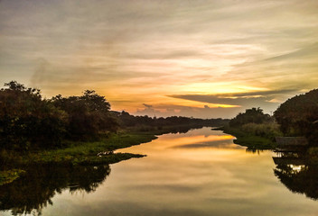 Obraz na płótnie Canvas River view and sunset.