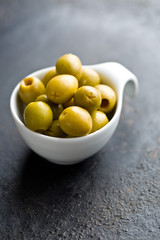 pitted green olives in bowl