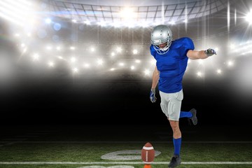 Composite image of american football player kicking ball