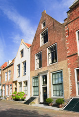 Fototapeta na wymiar Street with row of ancient brickwork mansions, Veere, Netherlands