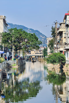 Waterway with bridge in old traditional neighborhood, Wenzhou, Zhejiang Province, China