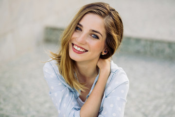 Portrait of a girl with a charming smile