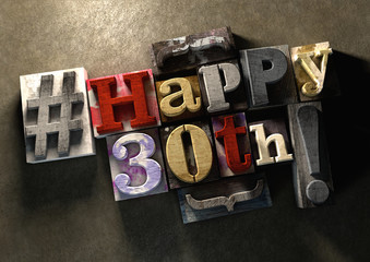 Ink splattered printing wood blocks with grungy Happy 30th birthday title text typography graphic background 