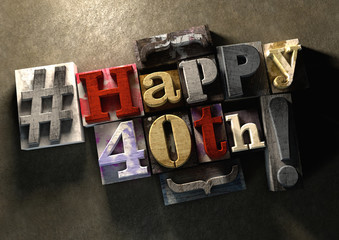 Ink splattered printing wood blocks with Happy 40th birthday grungy typography title