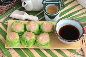 Chinese steamed dumpling and hot tea delicious.
