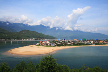 Lang Co beach, Hue province, Viet Nam. Lang Co is an attractive island-like stretch of palm-shaded white sand, with a turquoise lagoon on one side and 10km of beachfront on the other.
