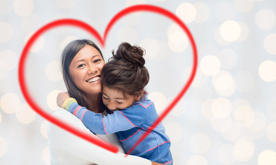 happy mother and daughter hugging