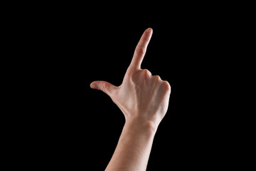 Gesture, young woman's hand indicates the direction or touch devices