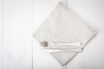 Kitchen. Wooden kitchen table with empty red tablecloth for dinner.