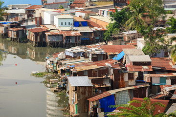 Fototapeta na wymiar Colorful squatter shacks and houses in a Slum Urban Area in early morning, Ho Chi Minh City, Vietnam