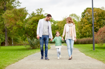 happy family walking in summer park