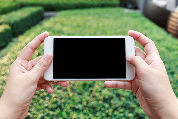 Close-up Of A Woman Hand Holding Cellphone Watching Video