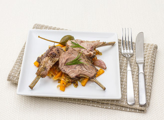 Grilled rack of lamb with carrot onion, garlic