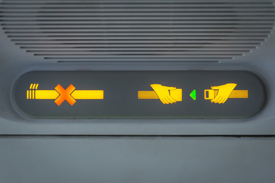 No Smoking and Fasten Seat belt Sign in the airplane