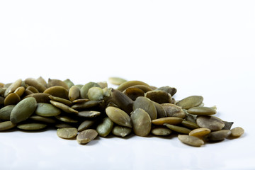Closeup View of Pumpkin Seeds on a Plain Background