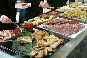 waiter while preparing food for catering
