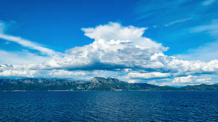 Clouds over the hills by the Adriatic sea in Croatia in summer