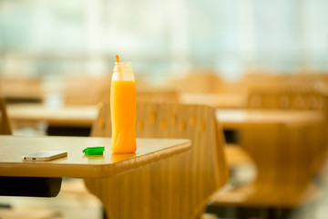 Bottle of orange juice on table.