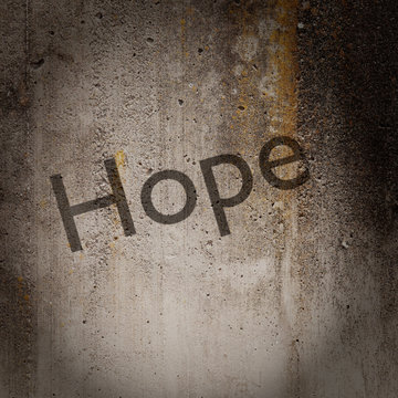 Word 'Hope' on grunge wall