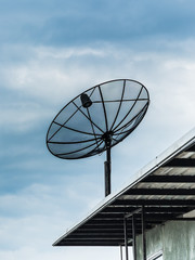 Satellite dish on blue sky background