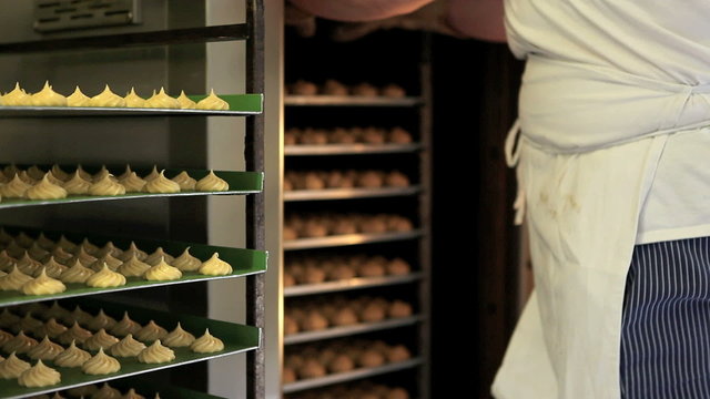 pastry chef works with oven, make sweet baked, industrial production