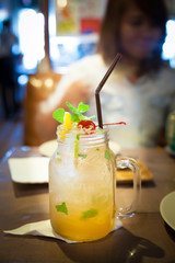 Mojito cocktail on blurred background of the bar