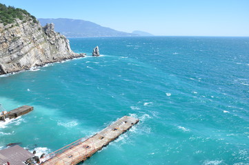 Wavy sea and a pier