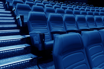 Empty rows of red theater or movie seats