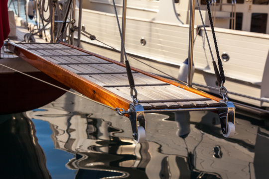 wooden ladder on marine yacht staying in port